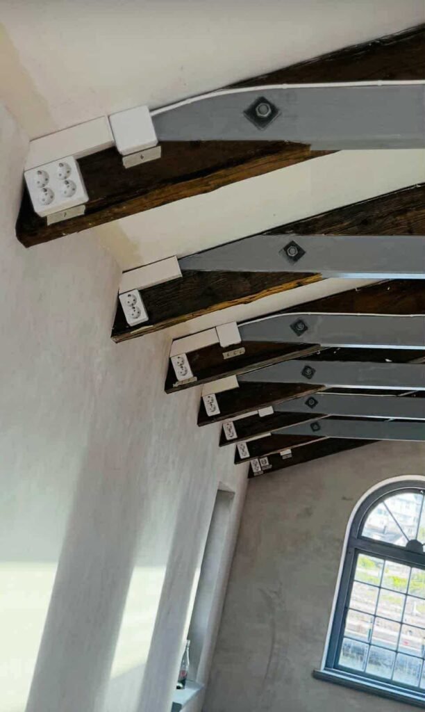 Wooden beams with metal supports.